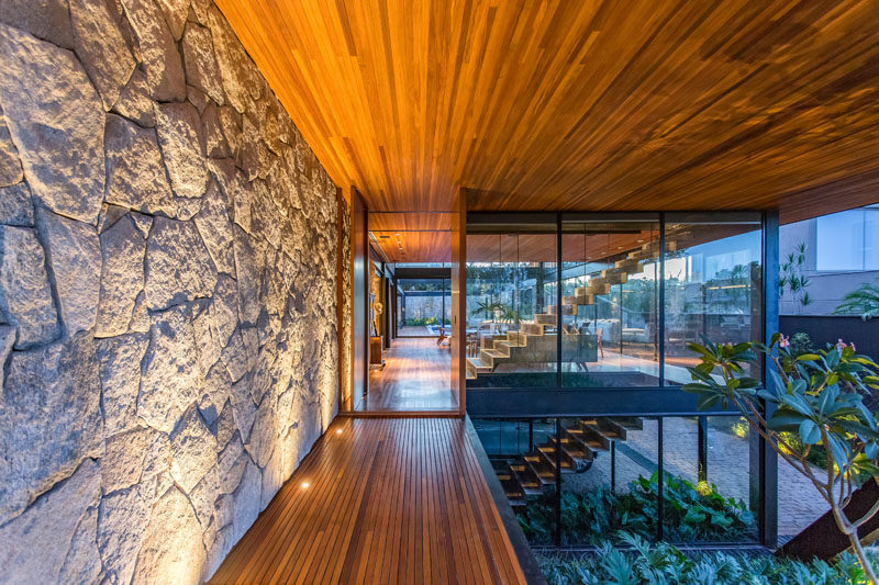 This Modern Tropical Home Floats Above A Base Of Stone And Glass pertaining to Lodge Design