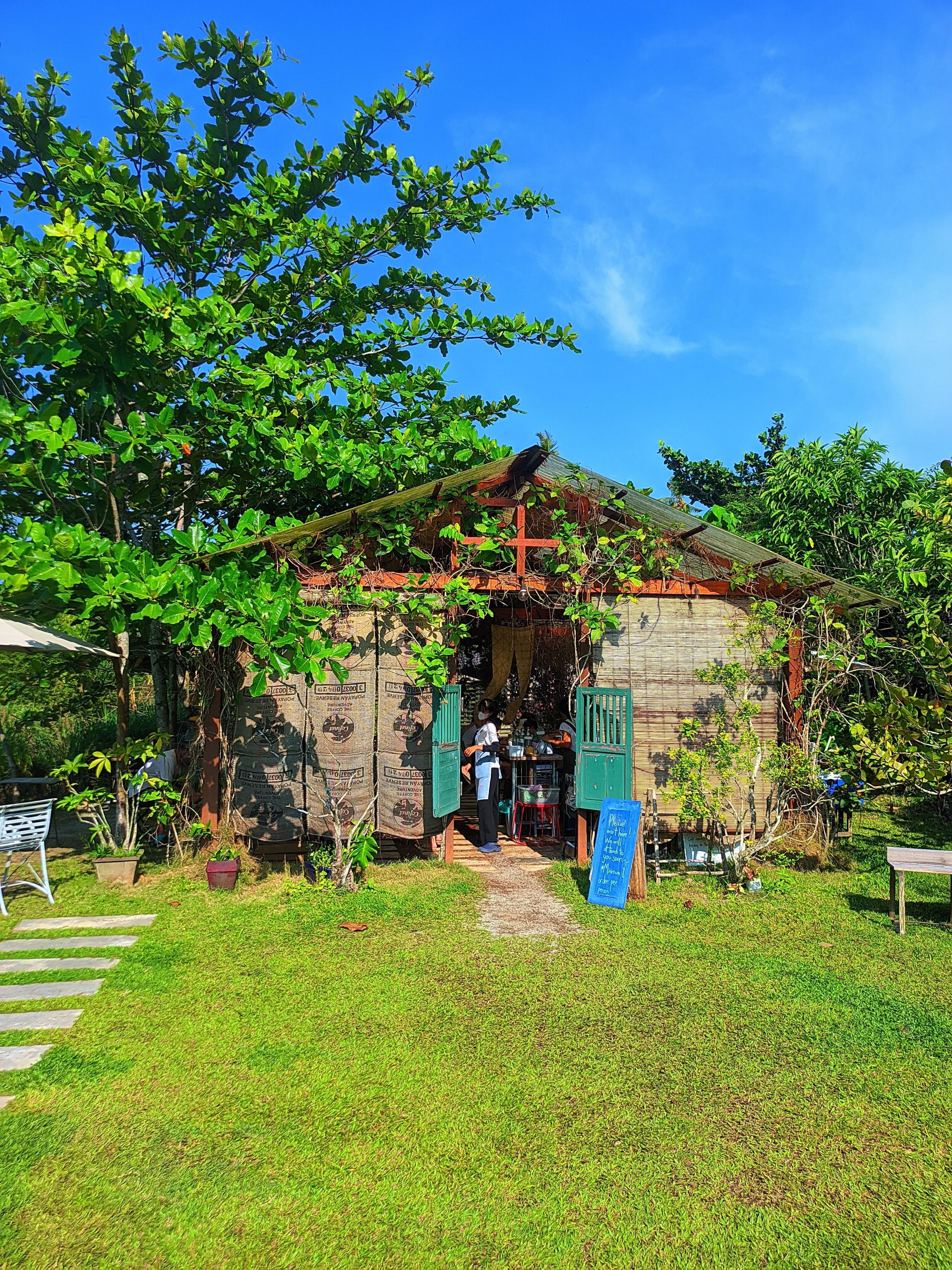 This Rustic Café Offers A Serene, Open-Air Dining Experience intended for Outdoor Dining Area