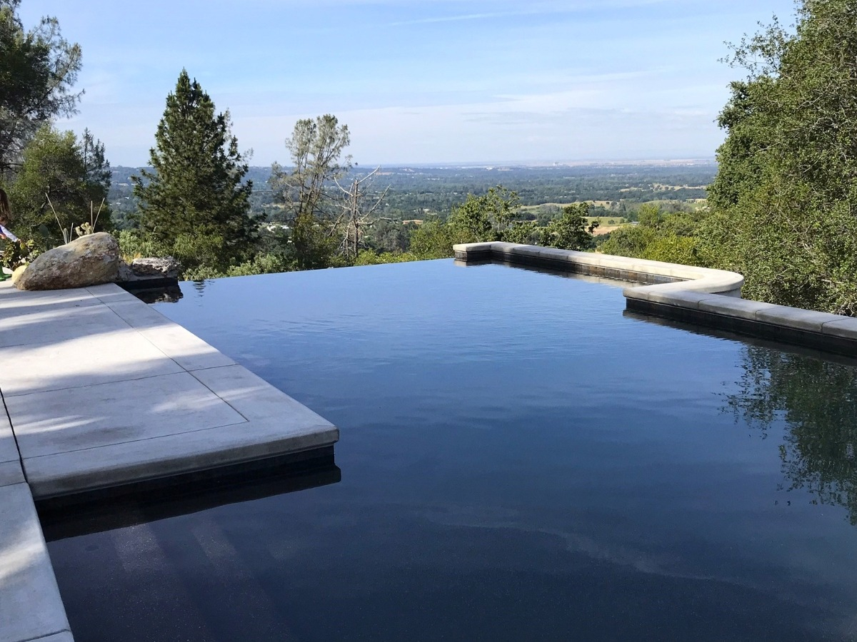 Surviving the Slope How to Safely Build a Zero Edge Pool on Steep Terrain