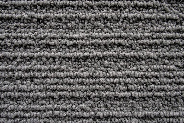Understanding frieze carpet durability and why those tightly wound fibers hide everyday footprints so well