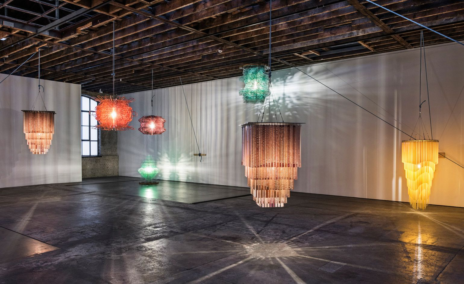 Exploring the Craftsmanship Behind Contemporary Resin Chandeliers and Sculptural Sconces