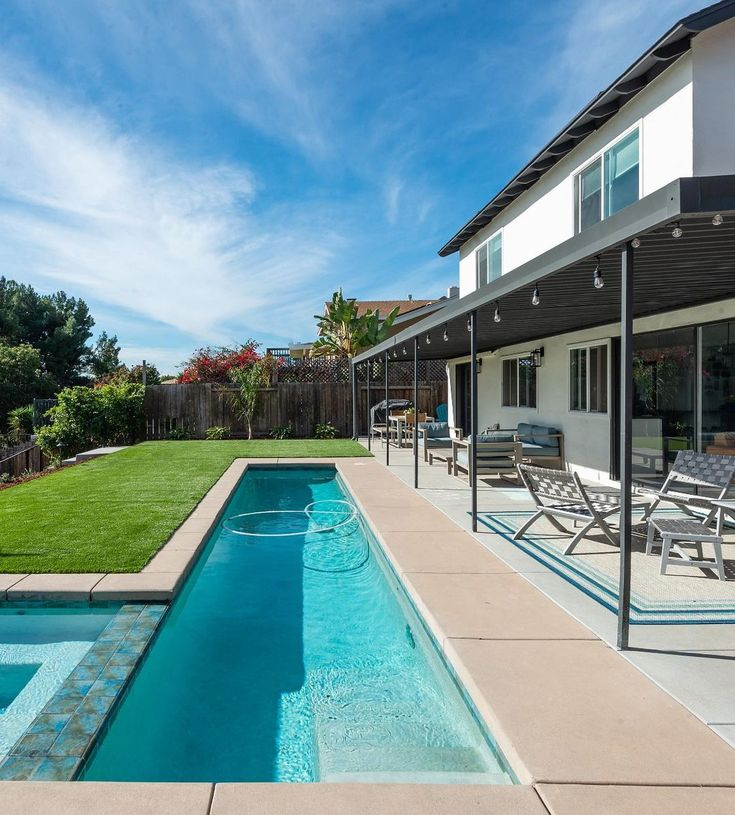 Transformed Sloped Backyard With Lap Pool And Slide within Lap Pool Design